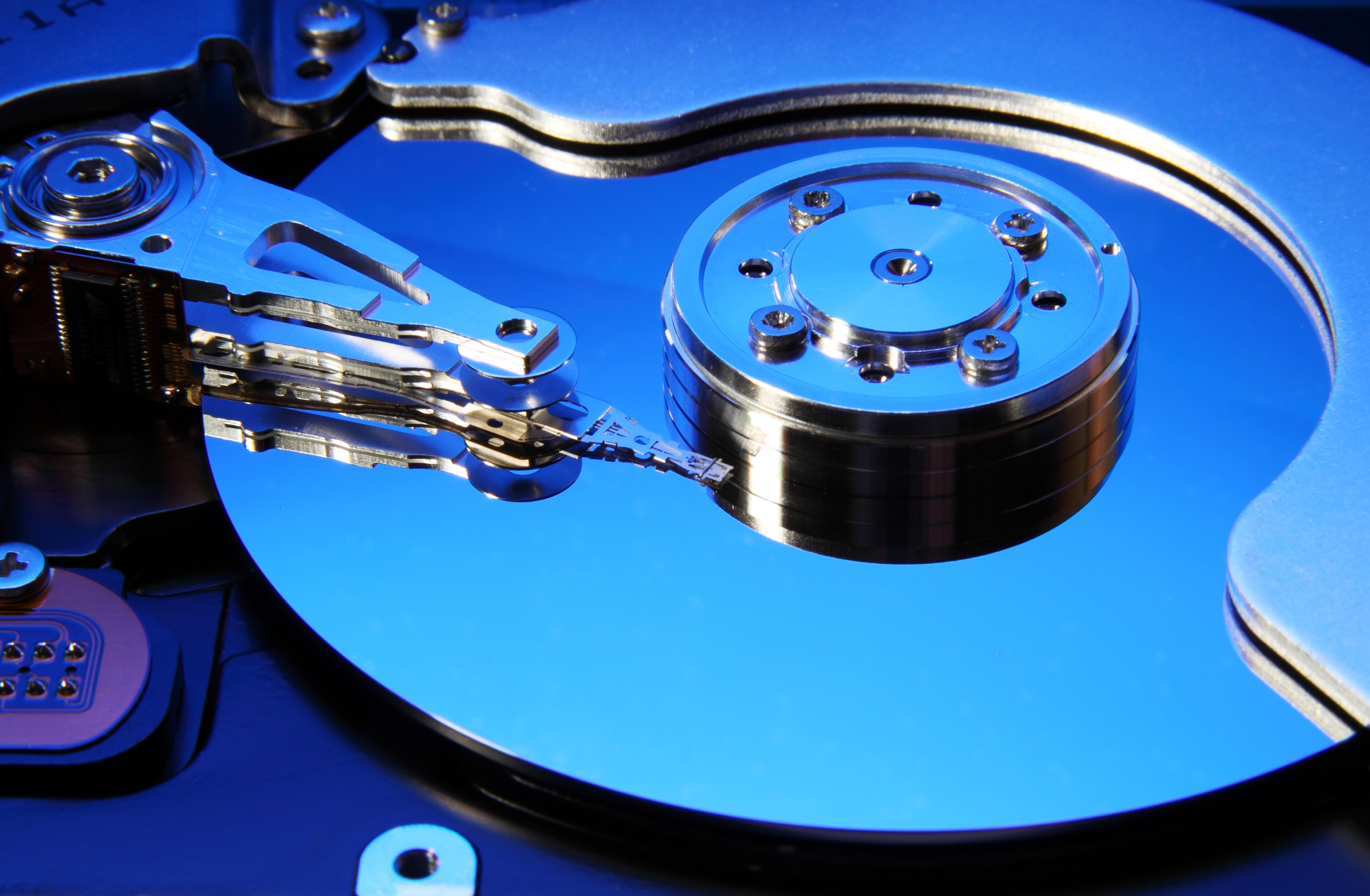 Photo of internal components of a a hard disk drive (HDD). If your data is trapped, we can help you get it back.